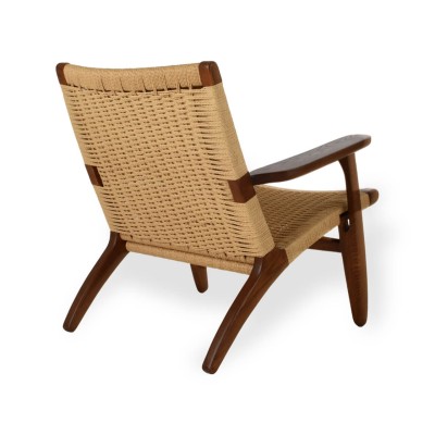 Replica of the Nordic Lounge CH25 armchair in walnut wood